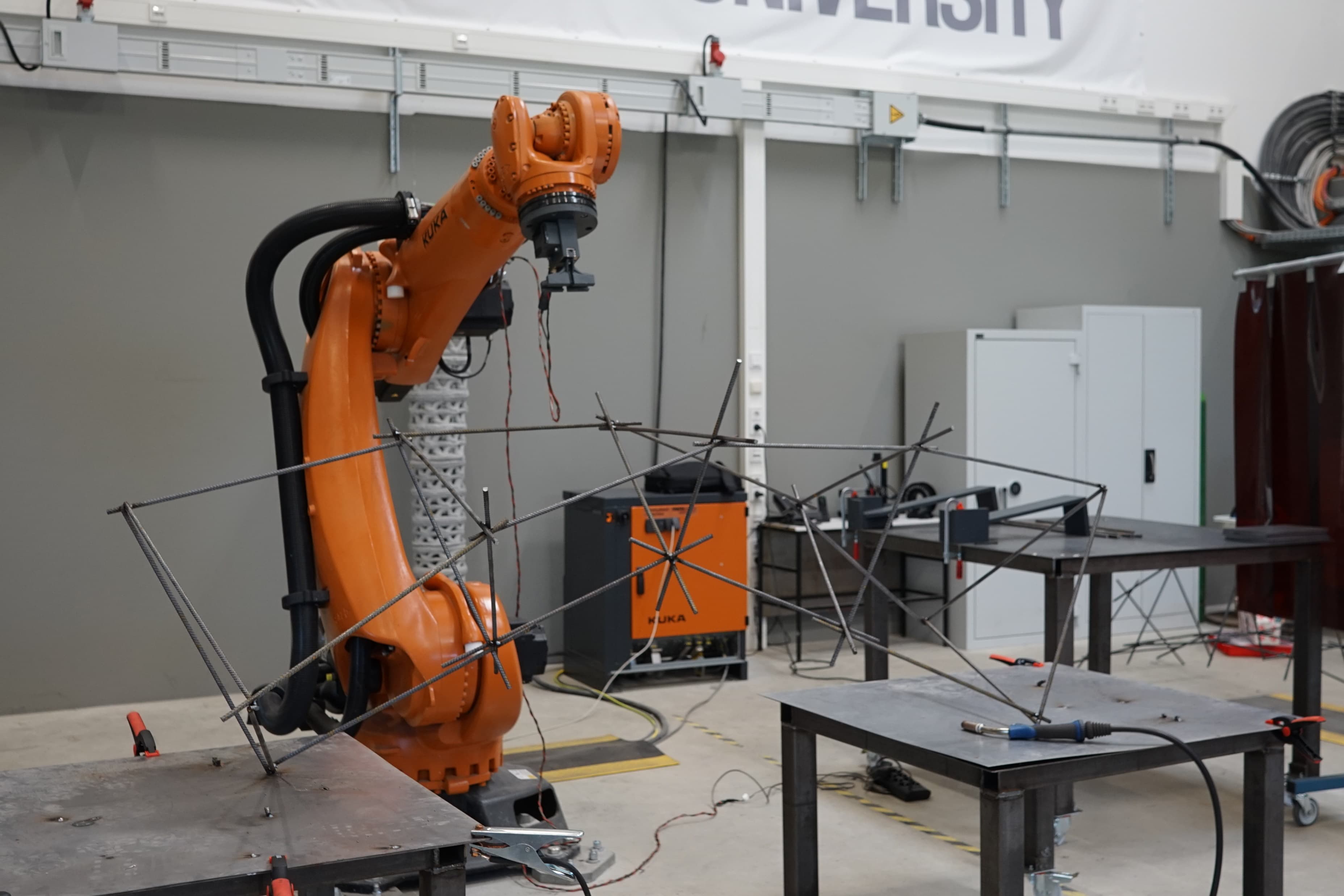 KUKA robot and completed rebar bridge assembly